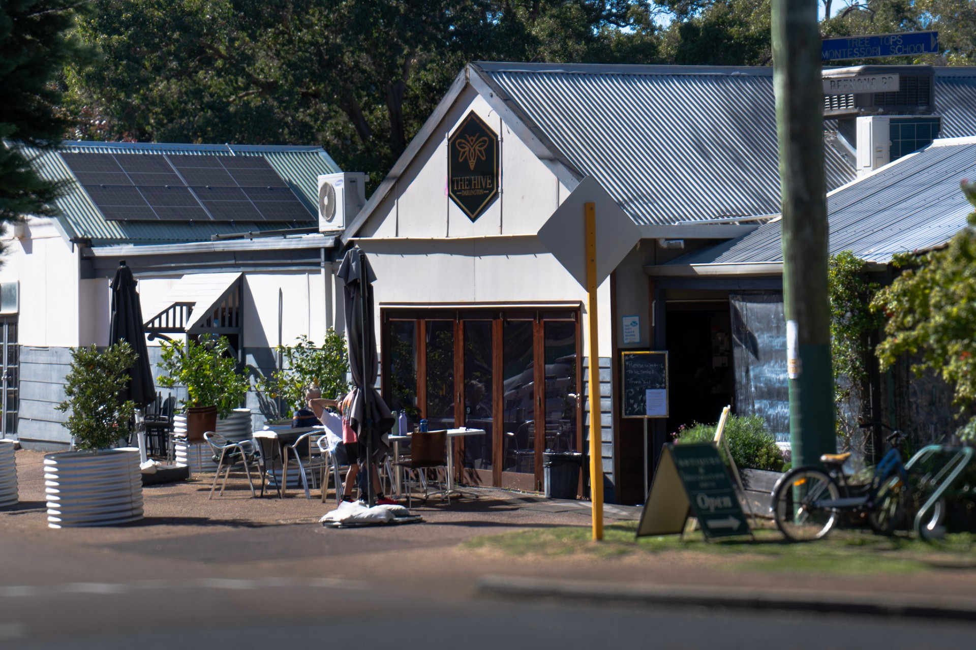 A peaceful verandah at The Hive Darlington with hanging plants and gum trees